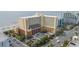 Great shot of the exterior of a beachside resort, showing parking, lush landscaping, and easy beach access at 6900 N Ocean Blvd. # 915, Myrtle Beach, SC 29572