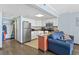 Open living space with kitchen, stainless steel appliances and comfortable seating area at 6900 N Ocean Blvd. # 915, Myrtle Beach, SC 29572