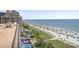 Stunning ocean view from the balcony overlooking beach and nearby building at 6900 N Ocean Blvd. # 915, Myrtle Beach, SC 29572