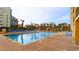 Large outdoor swimming pool with several lounge chairs and a colorful splashpad play area at 6900 N Ocean Blvd. # 915, Myrtle Beach, SC 29572