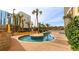 Outdoor pool area with a small decorative pool and a colorful splashpad play area in the background at 6900 N Ocean Blvd. # 915, Myrtle Beach, SC 29572