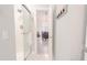 Bathroom with glass shower and view into the dining and living area at 698 Riverwalk Dr. # 304, Myrtle Beach, SC 29579