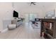 Bright living room features vaulted ceiling, hardwood floors, and sliding glass doors to balcony at 698 Riverwalk Dr. # 304, Myrtle Beach, SC 29579