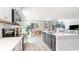 Open-concept kitchen view showcases island, stainless appliances, and seamless flow to dining and living spaces at 709 Rupert Dr, Conway, SC 29526
