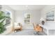Bright home office bathed in natural light, featuring a comfortable chair and a tranquil backyard view at 709 Rupert Dr, Conway, SC 29526