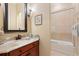 Elegant bathroom vanity with granite countertop and framed mirror with walk in shower at 7545 Ventura Ct., Myrtle Beach, SC 29572