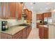 Spacious kitchen featuring granite countertops, stainless steel appliances and dark wooden cabinets at 7545 Ventura Ct., Myrtle Beach, SC 29572
