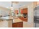 Gourmet kitchen features a granite island, custom cabinets, and stainless steel appliances at 7545 Ventura Ct., Myrtle Beach, SC 29572