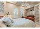 Beautiful bedroom featuring tray ceilings, a dresser, and lots of natural light at 7545 Ventura Ct., Myrtle Beach, SC 29572