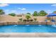 Sparkling backyard pool with travertine deck and manicured landscaping at 7545 Ventura Ct., Myrtle Beach, SC 29572