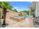 Beautiful backyard pool with integrated spa and a travertine deck with lounge seating at 7545 Ventura Ct., Myrtle Beach, SC 29572