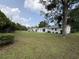 Spacious backyard with mature trees surrounding the home at 7611 Coteswood Dr., Myrtle Beach, SC 29572