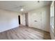 Bright bedroom with ceiling fan, wood-look flooring, and ample closet space at 7611 Coteswood Dr., Myrtle Beach, SC 29572