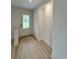 Bright entryway featuring wood-look floors and a front door with glass panels at 7611 Coteswood Dr., Myrtle Beach, SC 29572