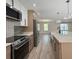 Modern kitchen featuring stainless steel appliances, quartz countertops, and a large island at 7611 Coteswood Dr., Myrtle Beach, SC 29572