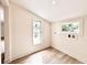 Laundry room featuring tile floors, two windows, and washer/dryer hookups at 7611 Coteswood Dr., Myrtle Beach, SC 29572