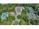 Experience luxury living with this aerial view of the community pool, tennis courts, and beautiful landscaping at 816 Morrall Dr., North Myrtle Beach, SC 29582