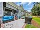 Beautifully landscaped backyard with patio, swing and comfortable seating ideal for outdoor entertaining and relaxation at 816 Morrall Dr., North Myrtle Beach, SC 29582