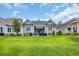 Inviting backyard featuring a well-manicured lawn and cozy patio seating area perfect for outdoor relaxation at 816 Morrall Dr., North Myrtle Beach, SC 29582