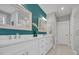 Beautiful bathroom boasts double sinks, white cabinetry, modern fixtures and a separate glass-door shower at 816 Morrall Dr., North Myrtle Beach, SC 29582