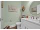 Charming half bathroom with a modern vanity, decorative mirror, and stylish fixtures at 816 Morrall Dr., North Myrtle Beach, SC 29582