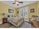 Cozy bedroom featuring a comfortable bed, window shutters, and a ceiling fan for added comfort at 816 Morrall Dr., North Myrtle Beach, SC 29582