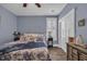 Bedroom features blue walls, plush bedding, and a ceiling fan for year-round comfort at 816 Morrall Dr., North Myrtle Beach, SC 29582