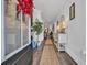 Bright entryway featuring hardwood floors, white walls adorned with art, and a decorative rug leading into the home at 816 Morrall Dr., North Myrtle Beach, SC 29582