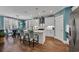 Bright eat-in kitchen featuring white cabinets, an island, and modern appliances at 816 Morrall Dr., North Myrtle Beach, SC 29582