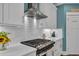 Modern kitchen showcasing white subway tile backsplash, updated appliances, and pantry at 816 Morrall Dr., North Myrtle Beach, SC 29582