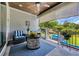 Cozy covered patio with stylish furnishings, wood-paneled ceiling, and a view of the landscaped backyard at 816 Morrall Dr., North Myrtle Beach, SC 29582