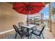 Balcony dining with furniture and large umbrella at 9661 Shore Dr. # B7-29, Myrtle Beach, SC 29572