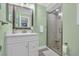Bathroom with shower, glass door and white vanity with silvertone faucet at 9661 Shore Dr. # B7-29, Myrtle Beach, SC 29572