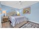 Comfortable bedroom featuring a queen bed with ocean-themed decor and soft lighting at 9661 Shore Dr. # B7-29, Myrtle Beach, SC 29572