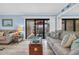 Comfortable living room with stylish furnishings and access to the private balcony at 9661 Shore Dr. # B7-29, Myrtle Beach, SC 29572