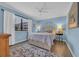 Serene primary bedroom with a queen-sized bed, soft rug, and a sunlit window at 9661 Shore Dr. # B7-29, Myrtle Beach, SC 29572