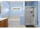Bright bathroom with a tub, separate shower, and window at 971 Mcnabb Rd., Loris, SC 29569
