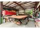 Image featuring the interior of a garage with trucks, equipment, and a high ceiling at 971 Mcnabb Rd., Loris, SC 29569