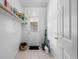 Mud room with a convenient shelf, tile flooring, and exterior door access for easy transitions at 971 Mcnabb Rd., Loris, SC 29569