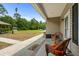 Cozy porch with wicker rocking chairs, offering a relaxing space with views of the surrounding landscape at 971 Mcnabb Rd., Loris, SC 29569