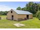 Spacious barn with metal roof, stalls and gated pen, perfect for horses and farm animals at 971A Mcnabb Rd., Loris, SC 29569