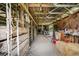 Spacious barn interior with stalls, equipment and hay storage, offering ample space at 971A Mcnabb Rd., Loris, SC 29569