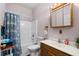 Bright bathroom featuring a shower/bath combo, vanity with sink and wooden mirror at 971A Mcnabb Rd., Loris, SC 29569