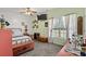 Light-filled bedroom with neutral walls, carpet, ceiling fan, a large window, and stylish furnishings at 971A Mcnabb Rd., Loris, SC 29569