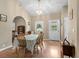 Charming dining area with wood flooring and a table with a green and white checkered tablecloth at 971A Mcnabb Rd., Loris, SC 29569