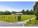 Expansive property with a well-maintained lawn and home, offering a serene setting at 971A Mcnabb Rd., Loris, SC 29569