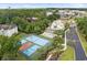 Aerial view of tennis courts, community pool, and lush landscaping at 9776 Leyland Dr. # 2, Myrtle Beach, SC 29572