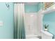 Bright bathroom with a shower-tub combo and a plant on the toilet at 9776 Leyland Dr. # 2, Myrtle Beach, SC 29572