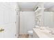 Cozy bathroom featuring a shower with curtain, decorative shelves, and tiled floors at 9776 Leyland Dr. # 2, Myrtle Beach, SC 29572