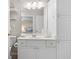 Bright bathroom with white cabinets, spacious countertops, and a large mirror at 9776 Leyland Dr. # 2, Myrtle Beach, SC 29572